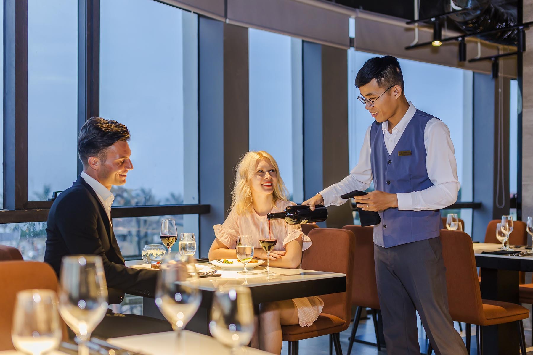Wine service in the ocean-view rooftop restaurant