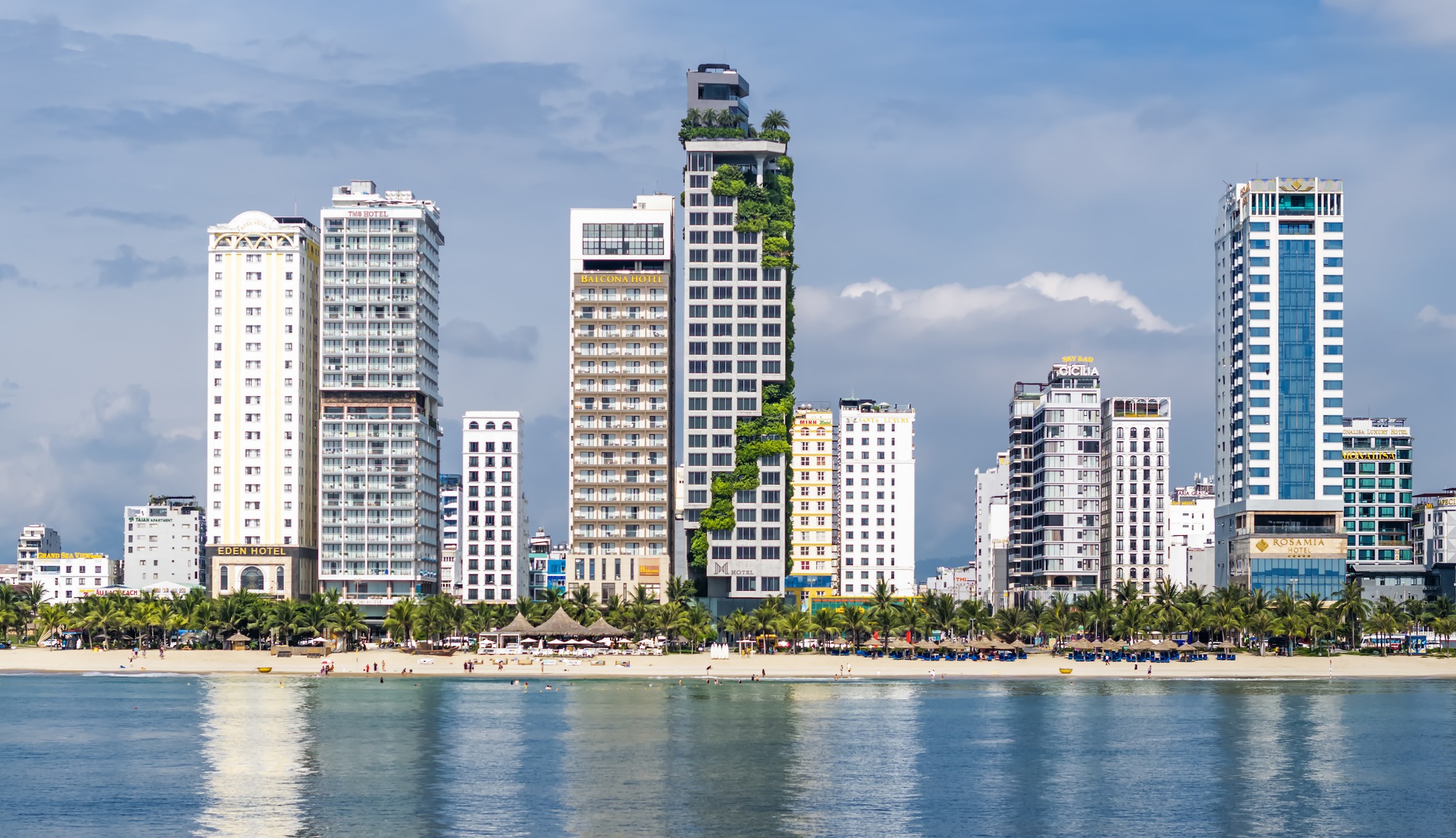 The M Hotel tower standing out on the My Khe skyline from the water